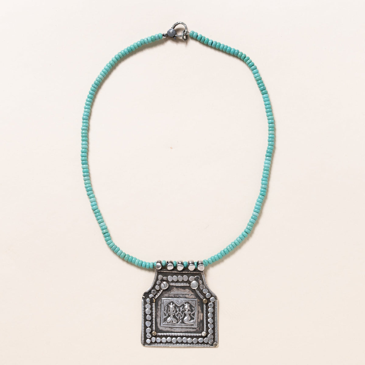 Kingman Turquoise Necklace with Silver Deity Pendant