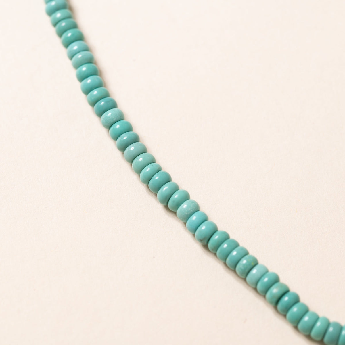 Kingman Turquoise Necklace with Silver Deity Pendant