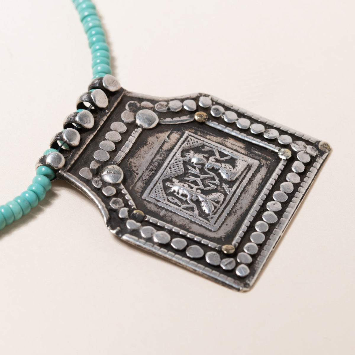 Kingman Turquoise Necklace with Silver Deity Pendant