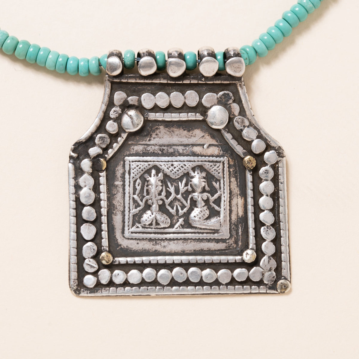 Kingman Turquoise Necklace with Silver Deity Pendant